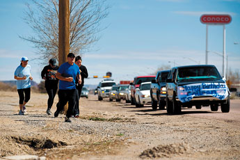 Friends and family of Colleen Lincoln run along Historic Route 66 Monday afternoon. Lincoln was recently murdered and would have turned 19 on Monday . The runners started at Mariano Lake and continued all the way to Arnold Street , where her remains were found. &copy; 2011 Gallup Independent / Brian Leddy 